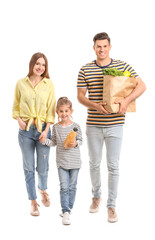 Family with food in bag on white background