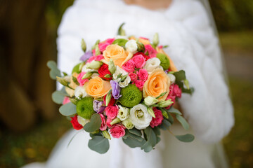 Wedding bouquet in hands of the bride