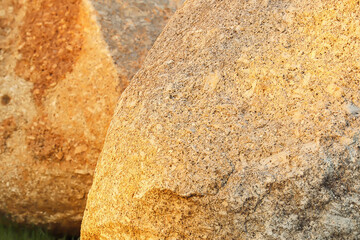 Photo image texture of heavy big rocks on outdoor summer twilight background.