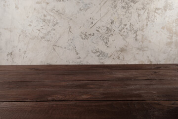 Image of wooden table in front of blurred background. Empty wooden table platform over background for present product.