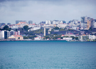 Fototapeta na wymiar Salvador, Brazil, a view of the city from the sea. The Lacerda Elevator. Salvador is a port city located in the North-East of Brazil on a small Peninsula almost triangular in shape. 