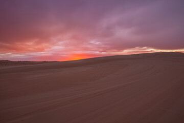 Colourful clouds over sand dunes at Myall Lakes National Park.East Coast of N.S.W. Australia.