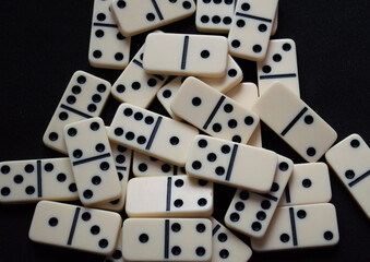 Closeup of a set of scattered domino pieces.