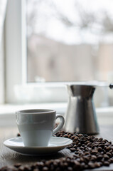 cup of coffee on the background of the window