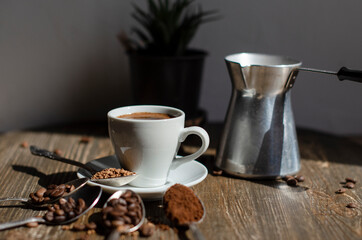 a cup of coffee on the table with different types of kefe in spoons