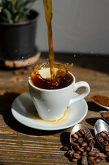 coffee splashes out of the cup