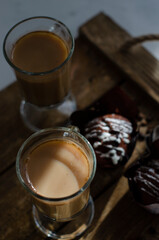 chocolate muffins on the table with a cup of coffee