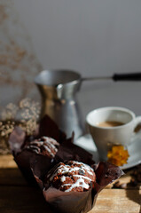 cup of coffee on the table with cupcakes