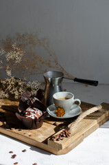 chocolate muffins on the table with a cup of coffee