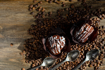 chocolate cupcake with sprinkled coffee beans on the table