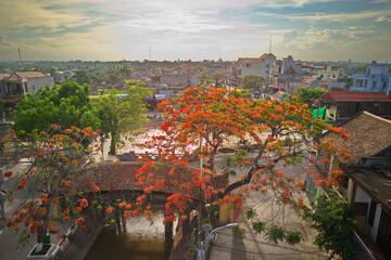 NAMDINH, VIETNAM - JUNE 7TH 2020: Aerial image of the Tiled Bridged in Hai Anh commune, Haihau Dist. is one of the most famous, beautiful and rarest ancient tiled bridges in Vietnam. © hcongthanh