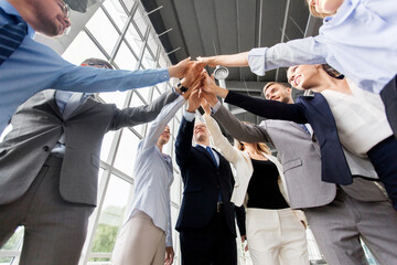 corporate, success and teamwork concept - happy business team making high five at office