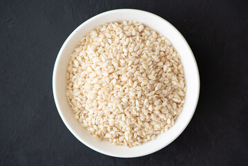 spices for cooking - white sesame seeds close-up