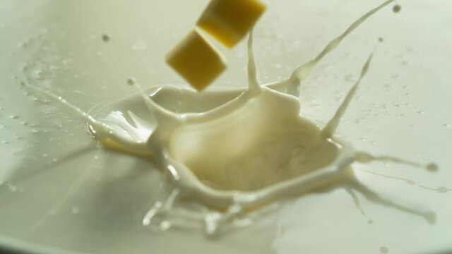 Highspeed Slow Motion Shot of butter squares hitting stirring milk. Shot on Phantom Flex 4K in 4K at 1000fps