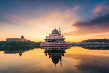 Dramatic and beautiful sunrise of floating Putra Mosque in Putrajaya, Malaysia