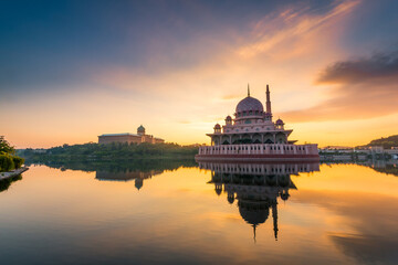 Dramatic and beautiful sunrise of floating Putra Mosque in Putrajaya, Malaysia
