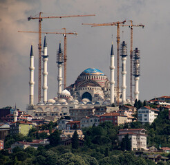 Naklejka premium Construction cranes surround a mosque being restored in Istanbul, Turkey