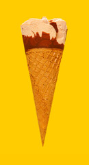 side view milk tea flavor ice cream cone on a yellow background