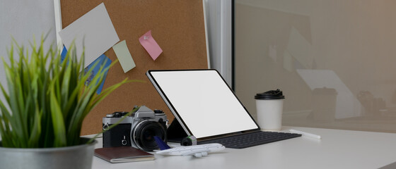 Travel preparation concept with mock-up tablet, camera, passport and accessories