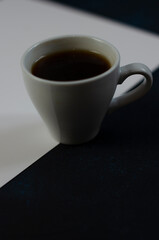 cup of coffee on double black and white background