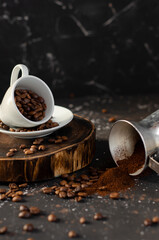 coffee beans in a small white cup. sprinkled coffee beans