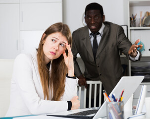 Upset woman with angry boss