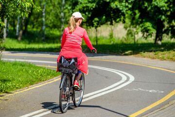 Cyclist ride on the bike path in the city Park
