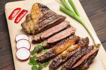 Sliced grilled marbled beef steak.