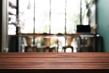 Empty wooden desk space platform with restaurant background for product display montage.