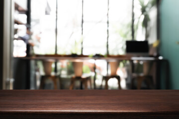 Empty wooden desk space platform with restaurant background for product display montage.
