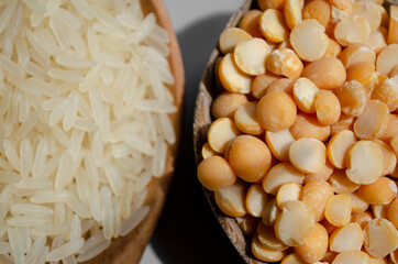 rice, buckwheat, peas in wooden spoons are on the table