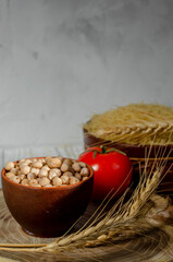 cereals in clay plates oatmeal, chickpeas, pasta
