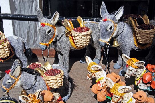 Souvenir donkeys displayed outside a shop in the village centre, Mijas, Spain.