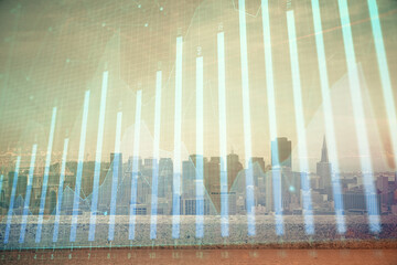 Forex graph on city view with skyscrapers background multi exposure. Financial analysis concept.