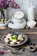Lazy cottage cheese dumplings with fresh berry. Simple and healthy breakfast