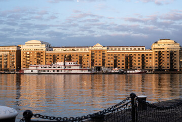 View of Butler's Wharf basked in the warm glow of a summer sunrise in London.