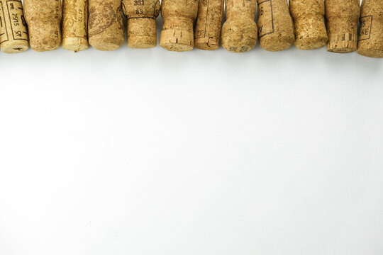
a large number of wine corks on a white background