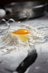 ingredients for cookies. broken eggs uphill with flour