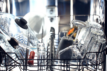 dishes in an open dishwasher, home style lifestyle, cleanliness and convenience background