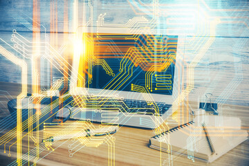 Double exposure of desktop with computer and world map hologram. International data network concept.