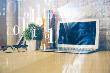 Double exposure of desktop computer and technology theme hologram. Concept of software development.