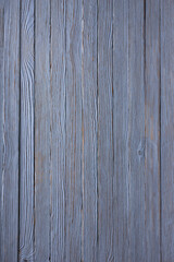 An old wood background painted blue. Cracks, bitches and texture. Photo, image.
