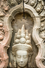 Fototapeta na wymiar Apsara and Ta Prohm temple ruins, Angkor Wat complex, Siem Reap, Cambodia.