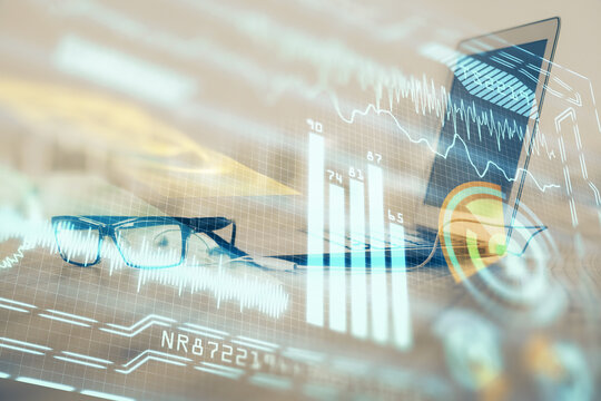 Computer on desktop in office with technology theme hologram. Multi exposure. Tech concept.