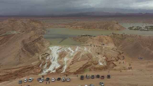 Flash Flood in the desert Waterfall- Aerial Footage Swifts flying around Hayon reservoir ,Wadi Nahal Hayon, Drone shot, Arava Desert, Israel