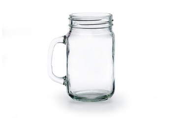 Empty glass jar on white ground.