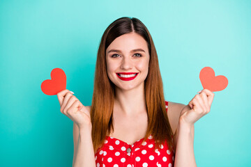 Portrait of cheerful dream dreamy girl hold small paper card heart she get her boyfriend on 14-february date holiday wear sundress isolated over turquoise color background