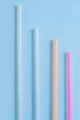  Plastic tube for drinks on a blue background.