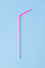  Plastic tube for drinks on a blue background.