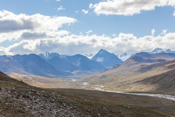 Fototapeta na wymiar View of the snowy mountains of Altai. Mongolia